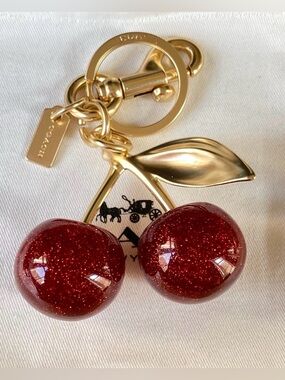 COACH CHERRY BAG CHARM